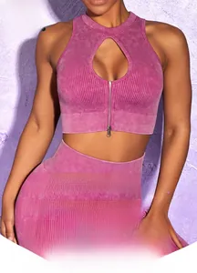 Detail of ribbed knit fabric texture on purple yoga set with front zipper and hollow design