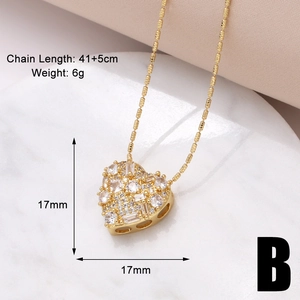 Detail of 17mm gold heart pendant with sparkling cubic zirconia on a beaded chain necklace