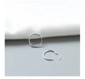 Detailed view of minimal S925 sterling silver hoop earrings with a high-polished mirror finish