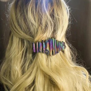 Close-up of a bohemian crystal spring hair clip worn on long wavy hair for party styling