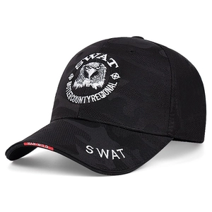 Close-up of black camouflage tactical hat with detailed SWAT embroidery and eagle patch