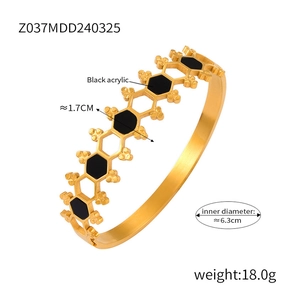 Detail showing 1.7cm width and 6.3cm diameter of gold hollow hexagon bangle