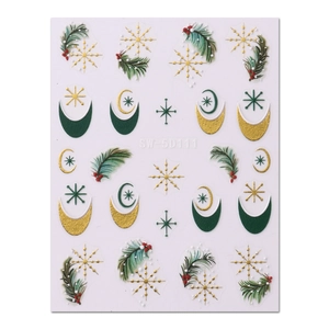 Festive Christmas nail art stickers with gold snowflakes, moons, and pine needles
