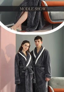 Detail of plush grey flannel bathrobe with shawl collar and white piping for couples
