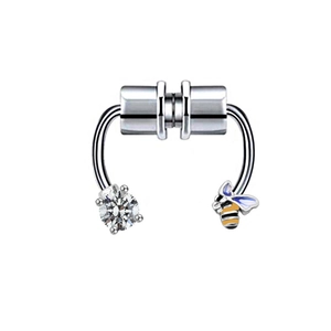 Macro shot of silver magnetic faux nose ring with zircon stud and enamel bee charm