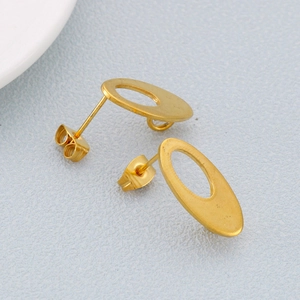 Minimalist gold stainless steel hollow oval stud earrings on a textured background