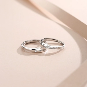 Elegant pair of 925 silver Mobius X-shaped rings with sparkling zircon accents