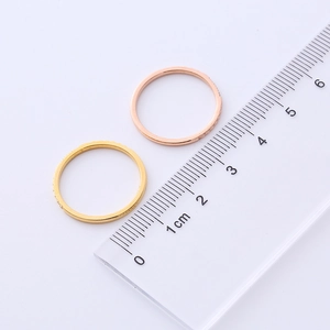 Measurement of 18K gold and rose gold rhinestone rings showing the inner diameter