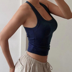 Slim fit navy blue ribbed knit tank top with U-neck for women in a minimalist style