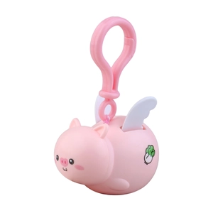 Pink cartoon flying pig keychain with white wings and cabbage motif on white background