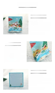 Detail showing 3D pop-up Christmas card with surfing Santa and ruled writing area