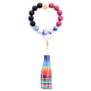 Beaded keychain bracelet with dark red marble silicone beads and rainbow fringe tassel