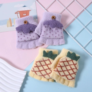 Close-up of cute purple polka dot and yellow pineapple knit convertible gloves for kids