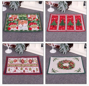Detail of Christmas rubber floor mats with Santa and tree motifs in rectangular shape