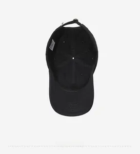Detail view of cotton baseball cap interior showing six-panel design and adjustable strap