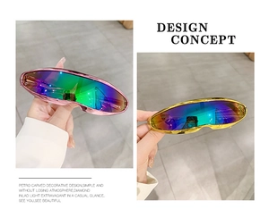 Close-up of futuristic Y2K wraparound sunglasses in pink and gold metallic frames