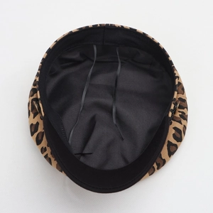Detail view of leopard print military cap showing inner black lining and adjustable drawstrings