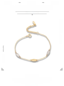 Detail of 925 silver bracelet with sunburst engraved shuttle charms and S925 hallmark