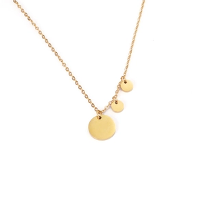 Macro shot of three polished gold round disc pendants on a fine link chain necklace