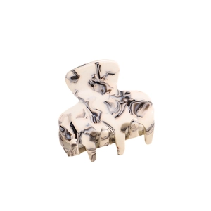 Elegant marble pattern acetate hair claw clip with black and white geometric design