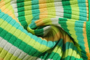Macro detail of multicolored ribbed knit fabric with green and white stripes texture