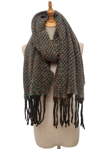 Detail of multi-color woven scarf with fringe on a beige mannequin, autumn texture