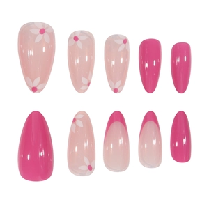 Pink almond press-on nails with french tips and floral patterns on white background