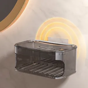 Wall-mounted double-layer soap dish in smoky gray plastic with drainage for bathroom