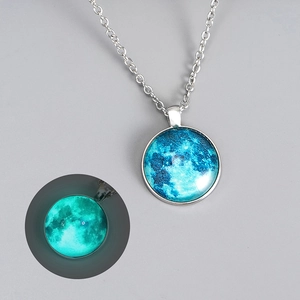 Luminous crescent moon pendant necklace in silver with glowing blue space galaxy glass orb