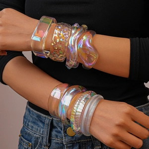 Iridescent acrylic geometric bracelets set showing colorful resin transparency on a model