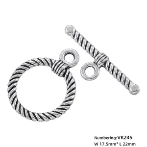 Close-up of vintage gold-plated toggle clasp with twisted texture for jewelry DIY