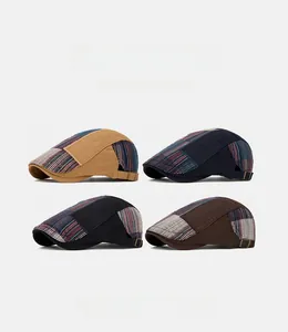 Detail view of four cotton flat caps in khaki, navy, black and brown with metal buckles