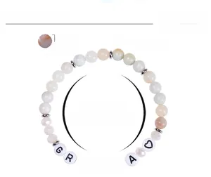 Detail of Amazon stone bracelet with 6mm beads and acrylic grandma heart lettering