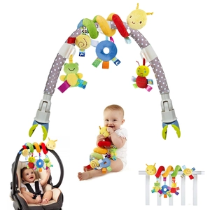 Detail showing plush animal hanging toys on a multi-colored stroller arch for babies