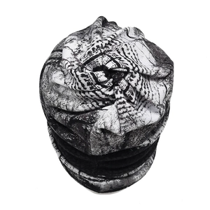 Detailed view of breathable slouchy beanie with black and white abstract print fabric