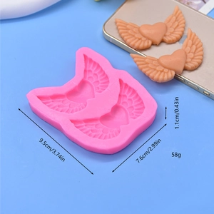 Pink silicone angel heart wings mold for DIY cake baking with dimensions 9.5x7.6cm