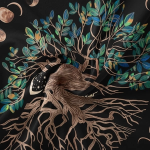 Detailed view of the tree of life and moon phase prints on black bohemian fabric