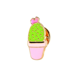 Close-up of green cactus enamel pin with pink flowers and a golden metal finish