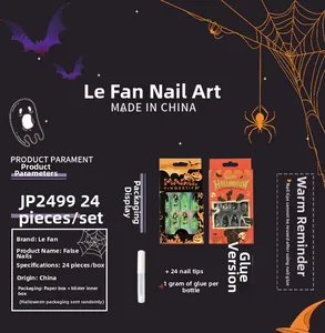 Detail view of Halloween press-on nails set with pumpkin, bat and spider web designs