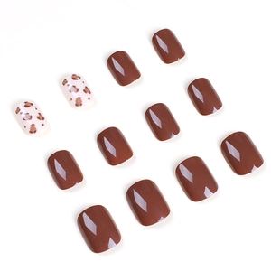 Glossy leopard print and brown square-oval press-on nails set on a clean white background