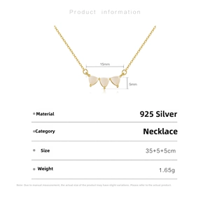Macro detail of S925 sterling silver necklace with three white teardrop stones