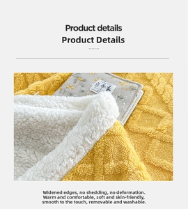 Close-up of yellow waffle knit fabric and white sherpa fleece lining on warm blanket