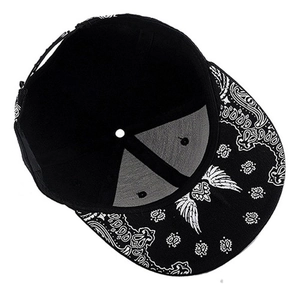 Hip hop flat brim baseball cap featuring black fabric and white paisley wing print
