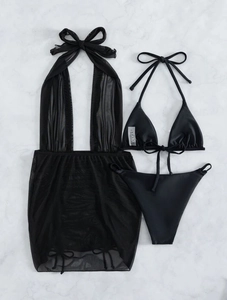 Flat lay of black three-piece bikini set including mesh drawstring cover-up on marble