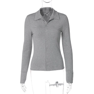 Detail view of the fine ribbed texture and buttoned polo collar on this slim grey knit shirt