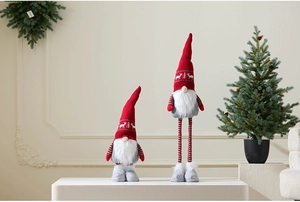 Macro shot of large Christmas gnome with adjustable legs and knitted snowflake pattern hat
