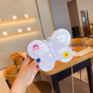 Detail of white butterfly jelly bag with gold chain and colorful floral charms