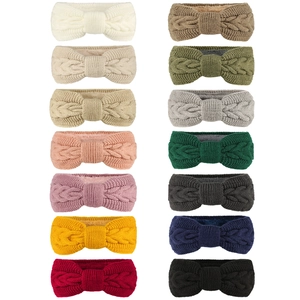 Fleece lined cable knit headband for winter in various colors with a bow-tie design