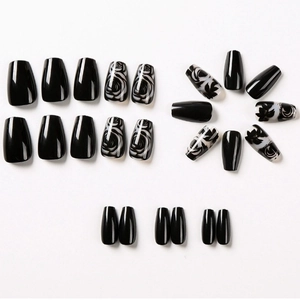 24-piece set of long trapezoid press-on nails in black with rose and marble designs