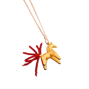 Fashionable golden horse pendant necklace with creative red glass bead tail detail
